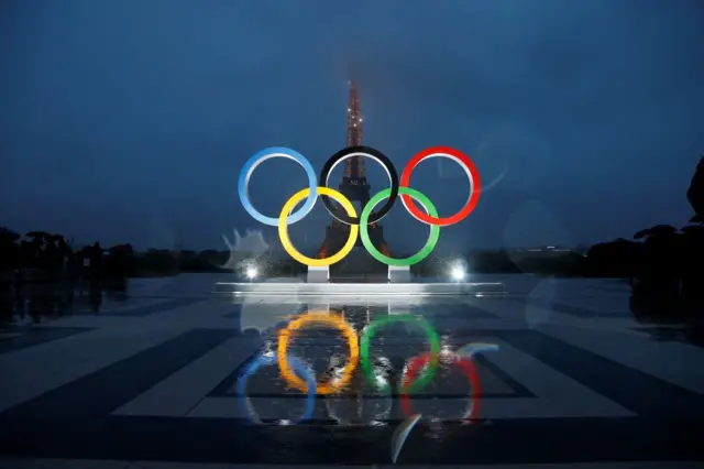 The Olympic rings sit in front of the Eiffel Tower in Paris.