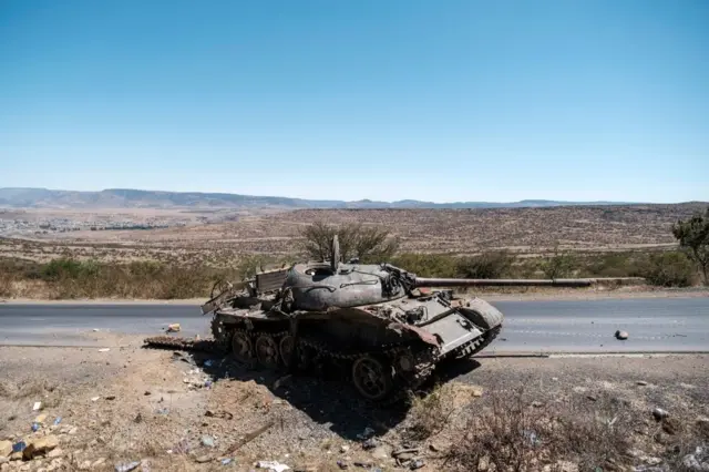 A damaged tank stands on a road north of Mekele, the capital of Tigray on February 26, 2021.