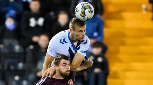 Lewis Mayo and Alan Forrest challenge for a high ball