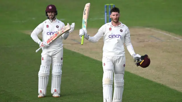 Rob Keogh celebrates scoring a century