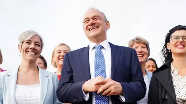 Ed Davey arrives at his party's conference with MPs Daisy Cooper and Layla Moran