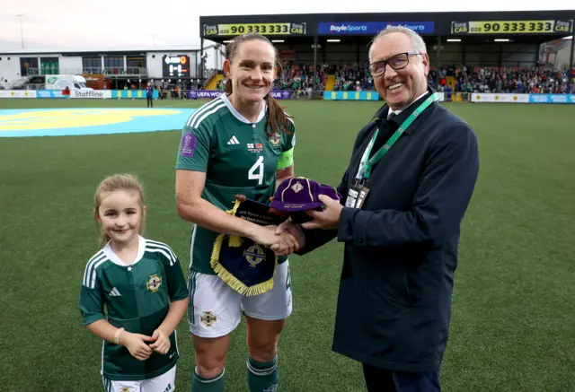 Sarah McFadden is presented with her 100th cap for Northern Ireland before kick-off