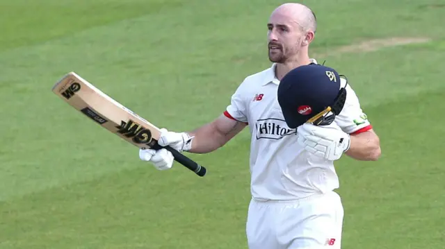 Josh Bohannon celebrates scoring a century