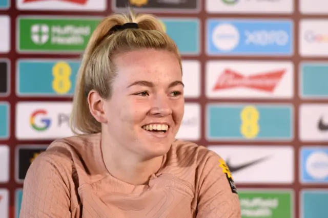 Lauren Hemp smiles while addressing the media in Utrecht.