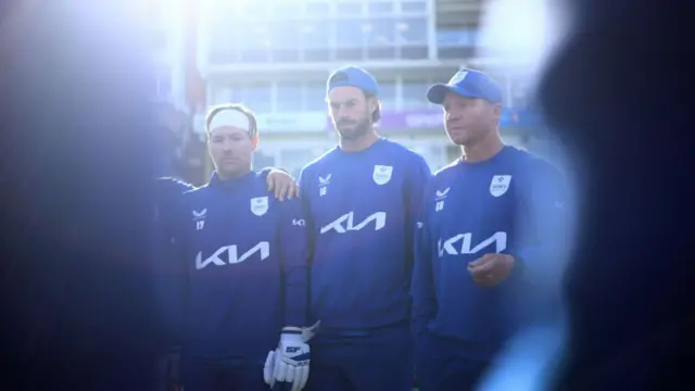 Surrey in team huddle