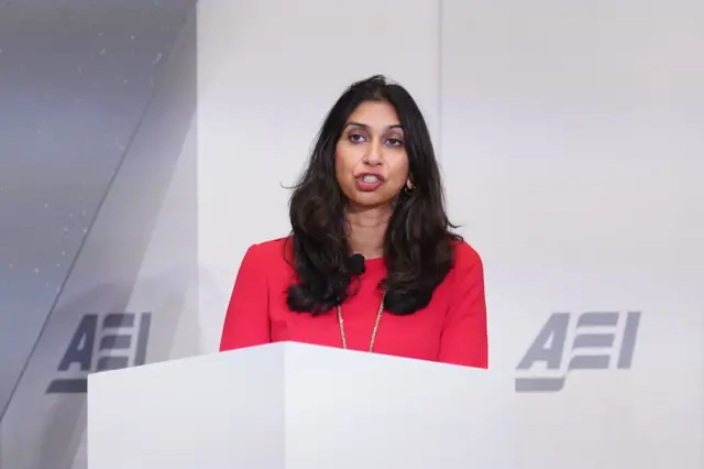 Braverman speaking at a dais in the United States