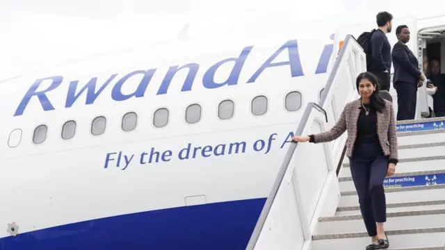 Braverman steps off a Rwanda Air plane