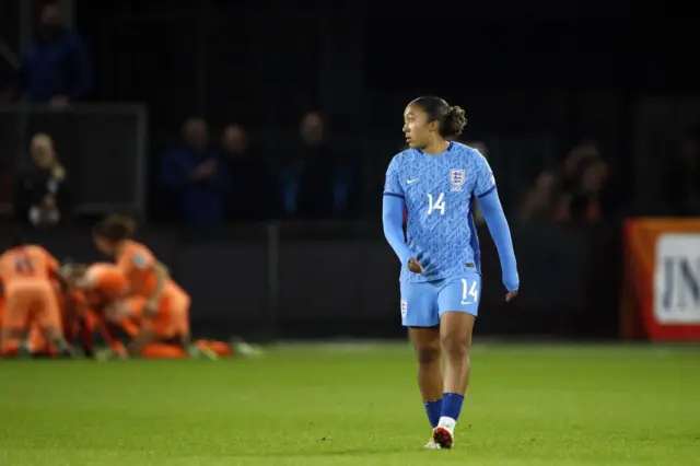 Jame strolls back to kick off as the Dutch celebrate in a pile behind her.