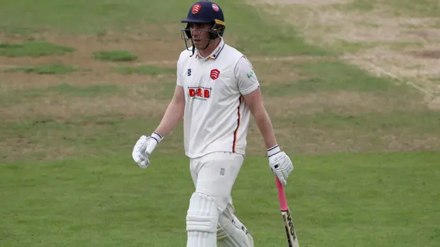 Dan Lawrence walks off the field