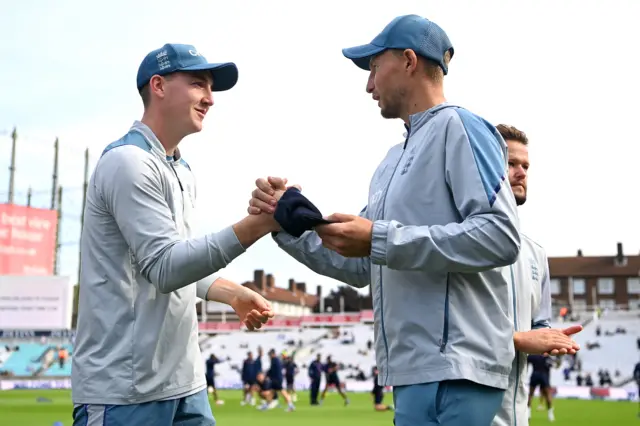 England's Harry Brook receives his Test cap from Joe Root