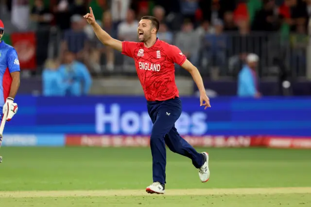 England's Mark Wood celebrates taking a wicket during the 2022 T20 World Cup