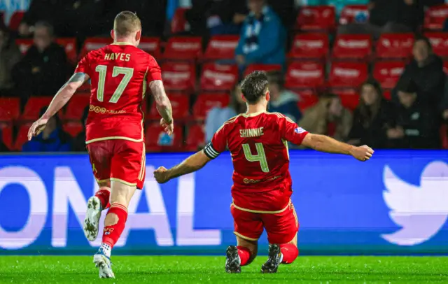 Graeme Shinnie celebrates