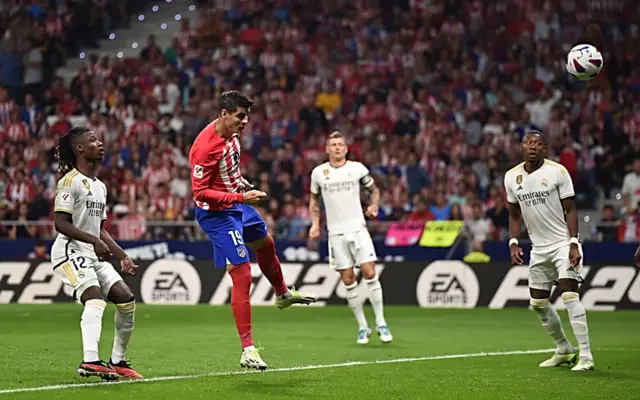 Atletico Madrid's Alvaro Morata scores against Real Madrid