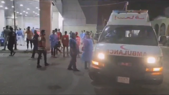 An ambulance bringing those injured in the wedding fire to a hospital in Mosul