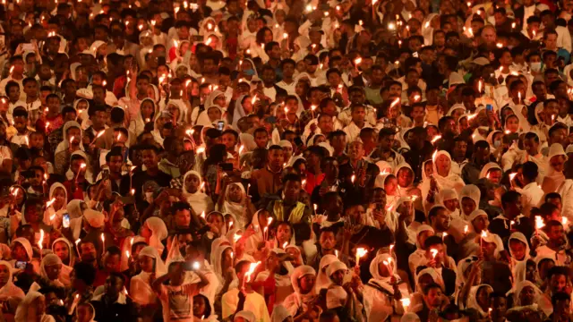 Ethiopian Orthodox faithful hold candles during the Meskel festival celebration to commemorate the discovery of the True Cross on which Jesus Christ was crucified, in Addis Ababa, Ethiopia,