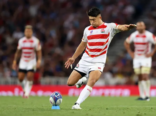 Rikiya Matsuda of Japan kicks a penalty