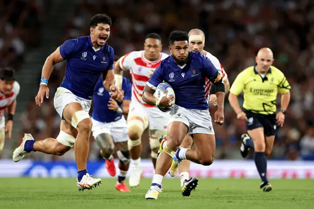 Tumua Manu of Samoa breaks with the ball