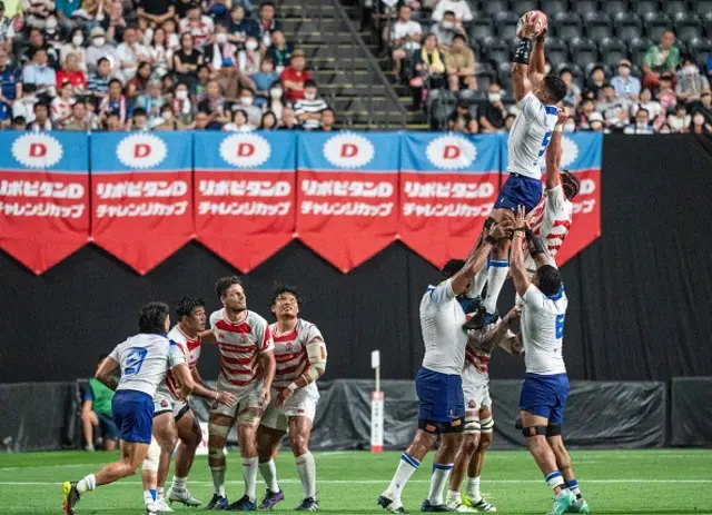Samoa's Michael Curry goes up for a throw during the rugby union match