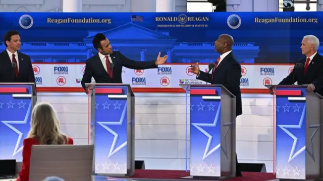 Florida Governor Ron DeSantis (L) and former US Vice President Mike Pence (R) look on as entrepreneur Vivek Ramaswamy (2L) and US Senator from South Carolina Tim Scott (2R) speak during the second Republican presidential primary debate at the Ronald Reagan Presidential Library in Simi Valley, California, on September 27,