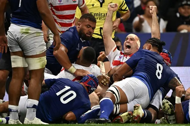 Japan's loosehead prop Craig Millar celebrates after Japan scored their third try