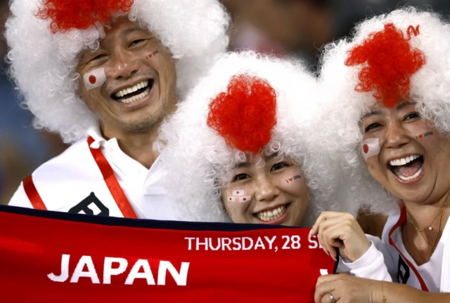 Japan fans pose ahead of kick-off