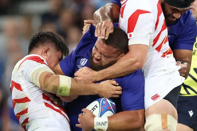 - Samoa's tighthead prop Paul Alo-Emile is tackled by Japan's lock Jack Cornelsen