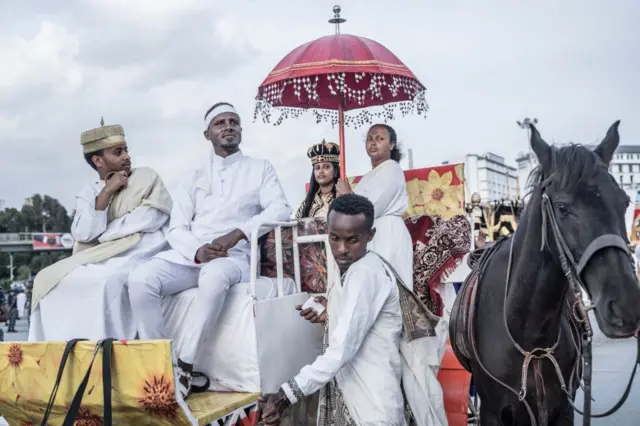 A group of youth dressed with royal costumes parade during the celebrations of the Ethiopian Orthodox holiday of Meskel in Addis Ababa on September 27, 2023.