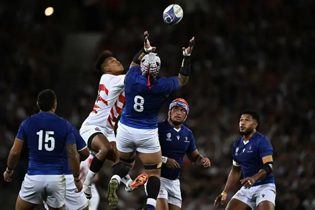 Japan's right wing Kotaro Matsushima  and Samoa's number eight Sa Jordan Taufua