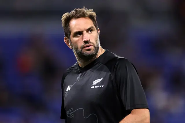 Samuel Whitelock of New Zealand looks on