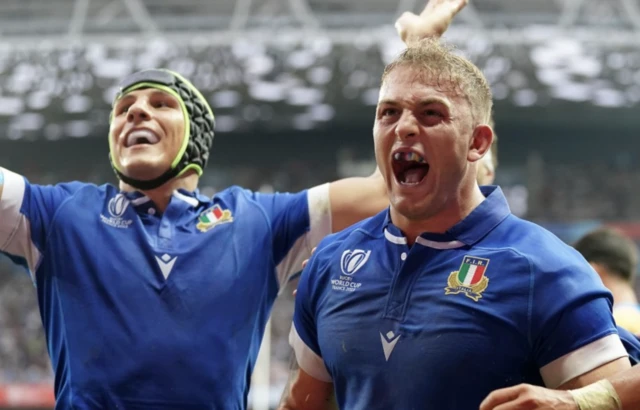 Italy's Lorenzo Cannone celebrates scoring with teammates