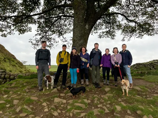 Imogen Potter and her family at the tree