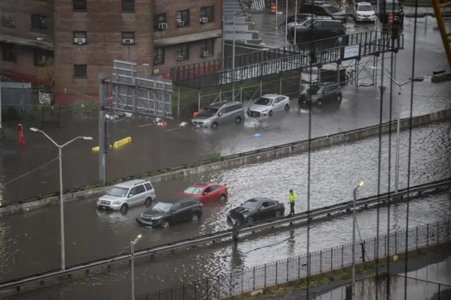 A general view shows cars stranded in floodwater on the FDR highway in Manhattan, New York on September 29, 2023