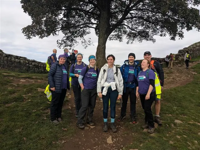 Charity walker Vivienne Ranson and friends at the Sycamore Gap tree last Saturday