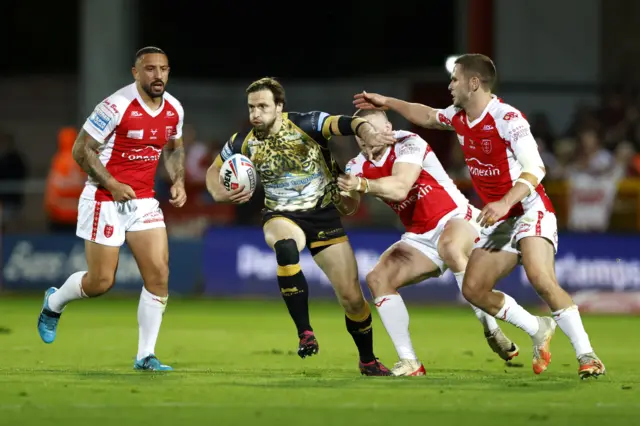 Joe Mellor runs with the ball for Leigh