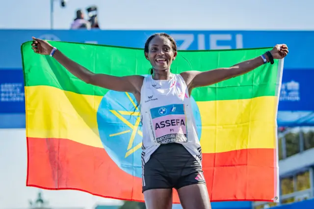 Tigist Assefa from Ethiopia celebrating after crossing the finish line and set a new world record of 2:11:53h during the 2023 BMW Berlin-Marathon on September 24, 2023 in Berlin, Germany.