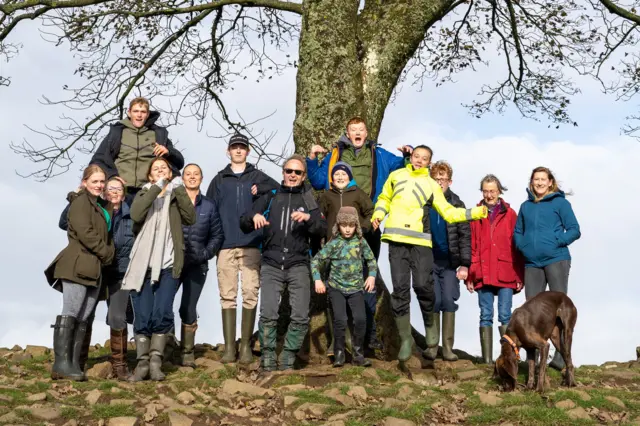 Miles Courage with family and friends at the Sycamore Gap tree in 2022