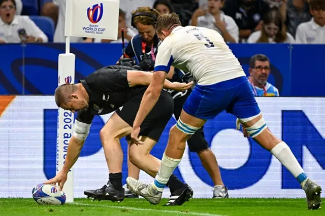 Dan Coles walks over the try line to score his second