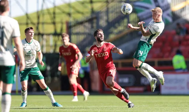 Jimmy Jeggo wins a header in midfield at Pittodrie