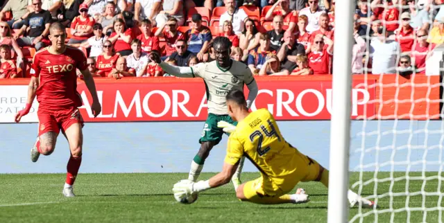 Hibernian's Elie Youan has a shot saved by Aberdeen goalkeeper Kelle Roos