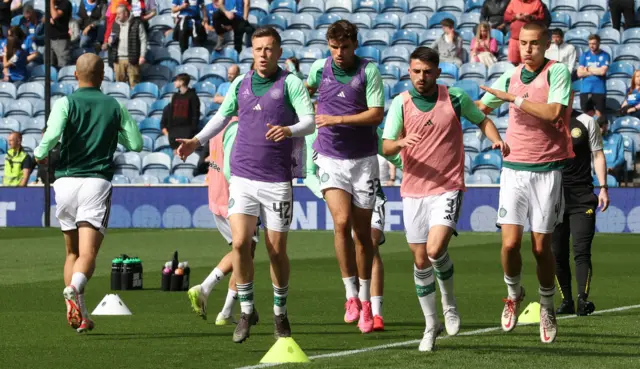 Celtic players warming up at Ibrox