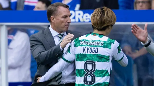 Kyogo with Brendan Rodgers