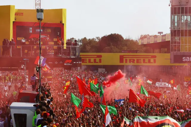 fans celebrate with Carlos Sainz who finished third