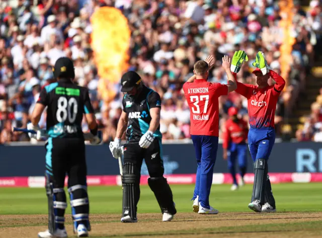 Gus Atkinson celebrates the wicket of Glenn Phillips with Jos Buttler