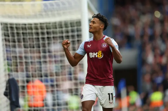 Ollie Watkins celebrates his goal at Stamford Bridge.