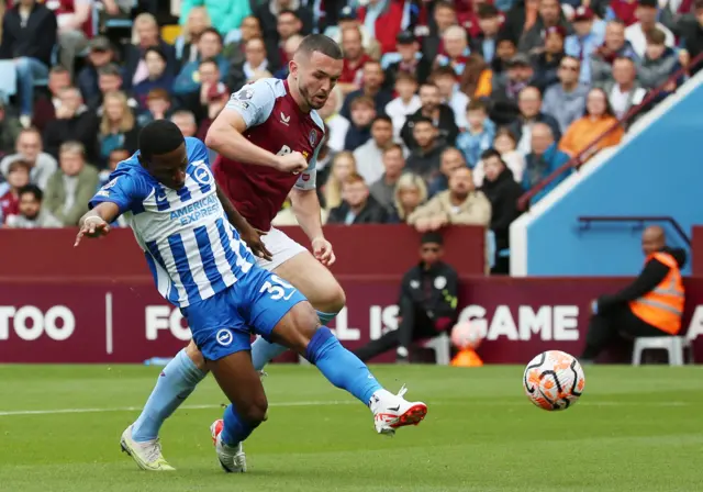 John McGinn and Pervis Estupinan who shoots at goal