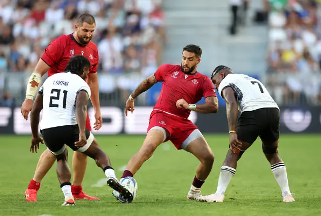 Frank Lomani of Fiji and Giorgi Kveseladze of Georgia contend for the loose ball