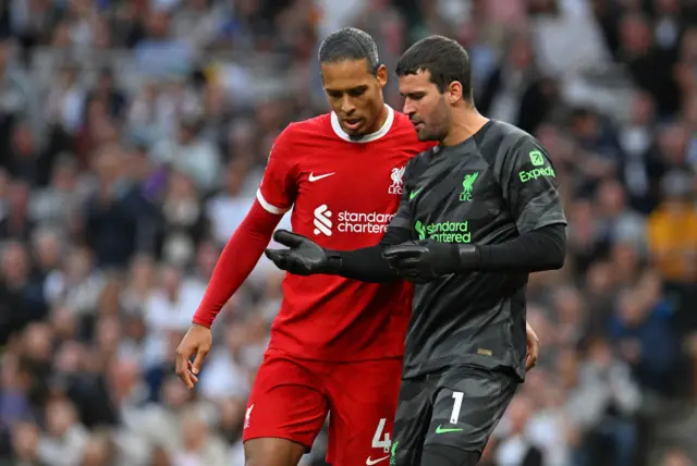 Virgil van Dijk and Alisson Becker