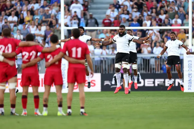 Georgia players look on as Fiji perform the Cibi