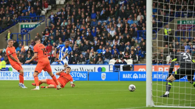 Delano Burgzorg scores for Huddersfield against Ipswich