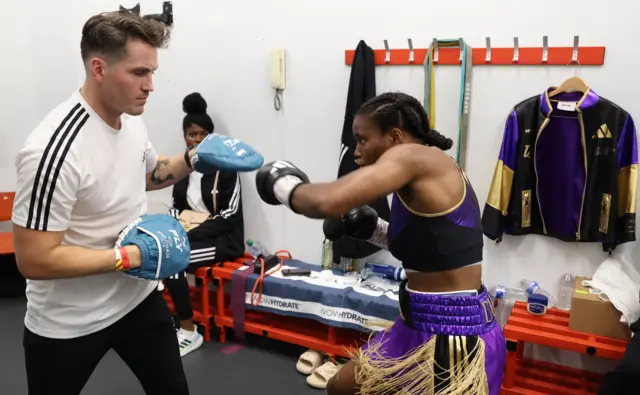 Shane McGuigan on the pads with Caroline Dubois